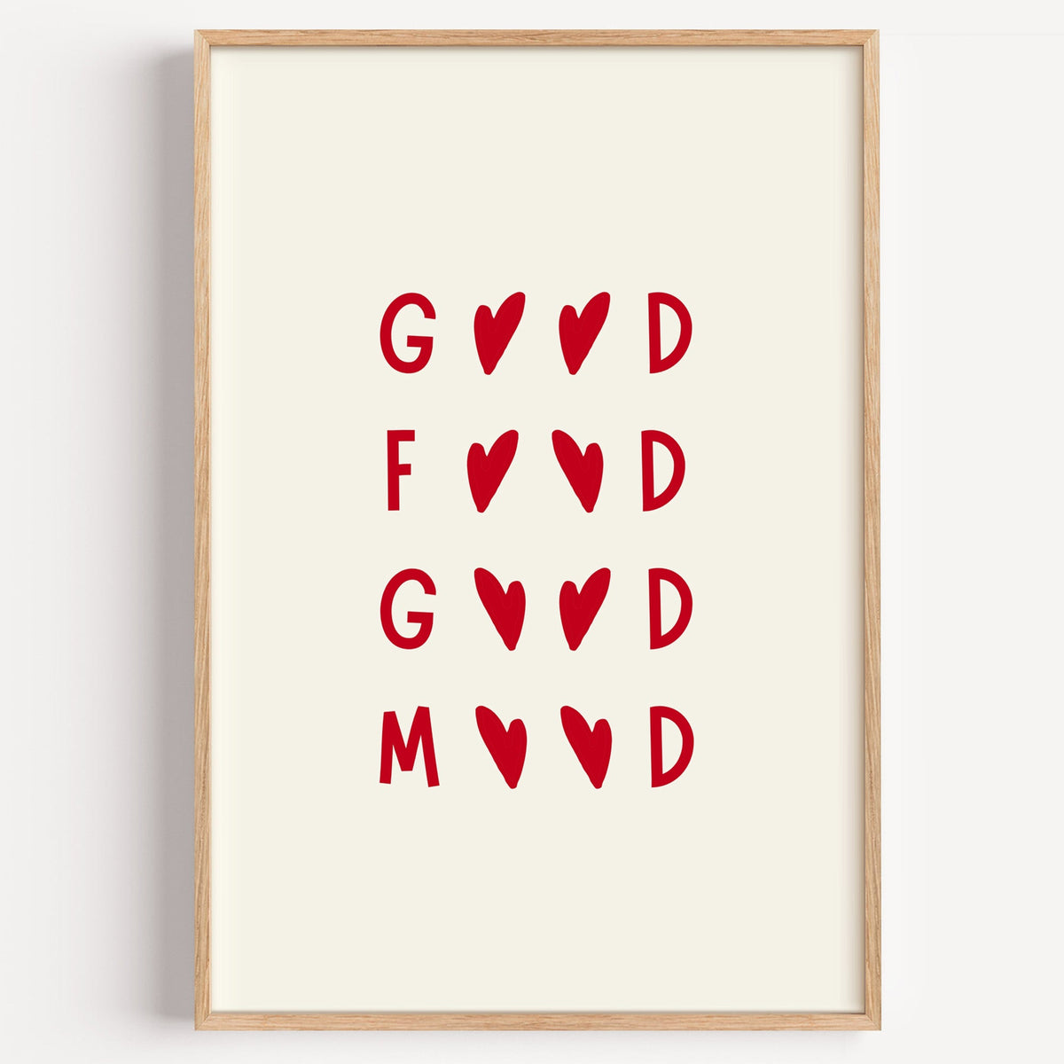 Good Food Good Mood heart typography print in a light oak frame on a plain white wall