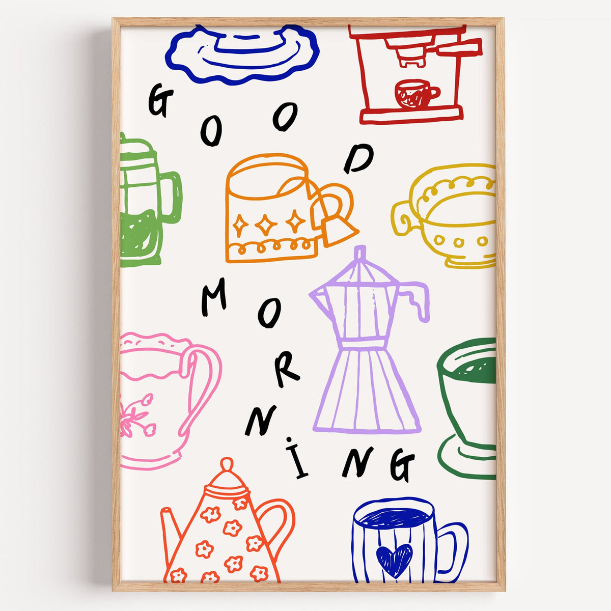 Good Morning coffee pot doodle print in a light oak frame on a plain white wall