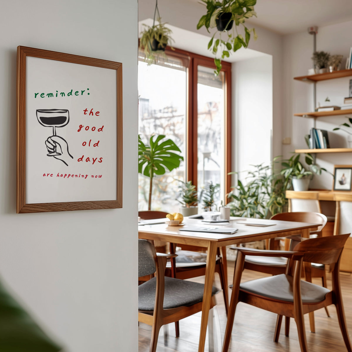 Good Old Days print in a walnut frame beside a mid-century dining table