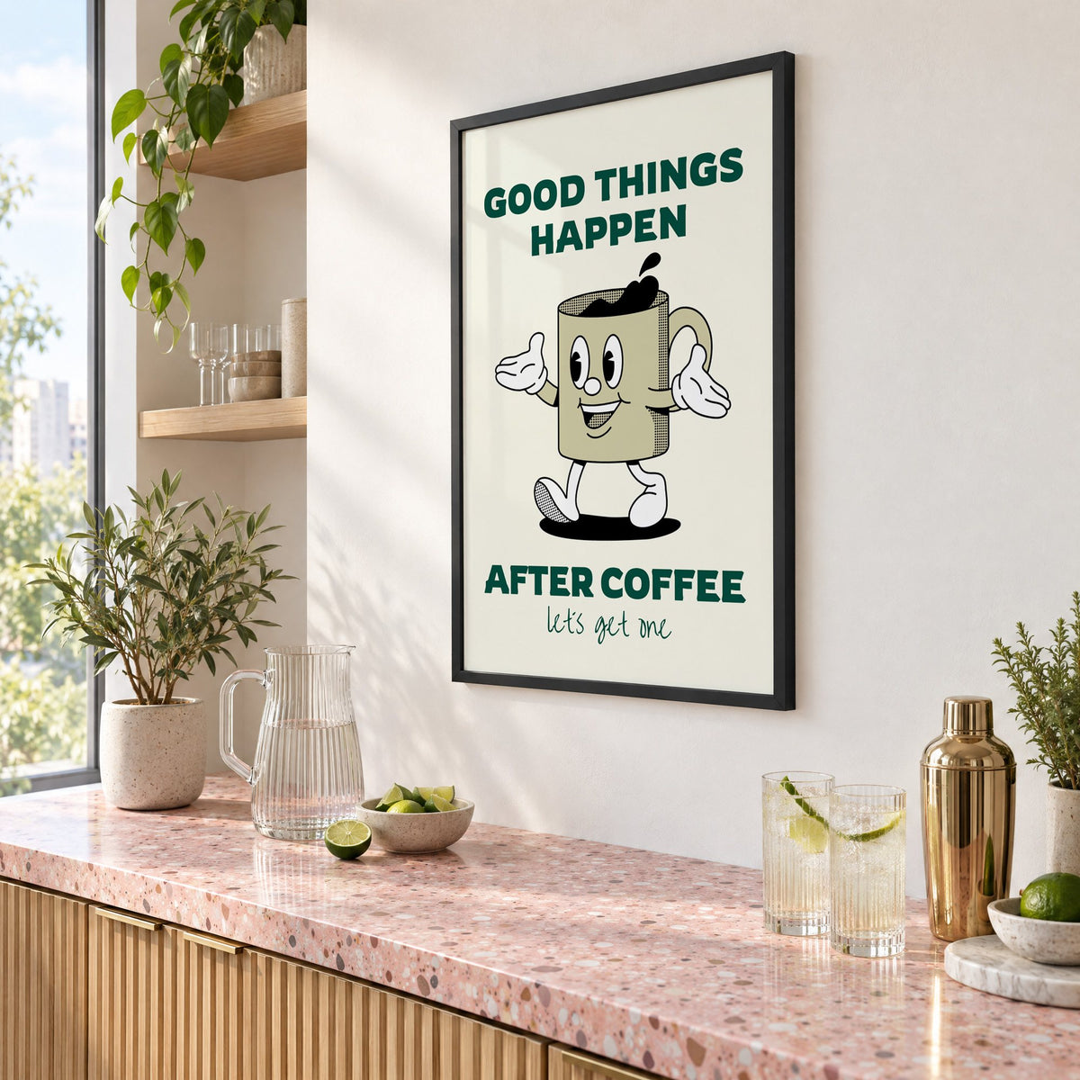 Good Things Happen After Coffee mug print in a black frame above a pink terrazzo cocktail counter with limes, seen at an angle