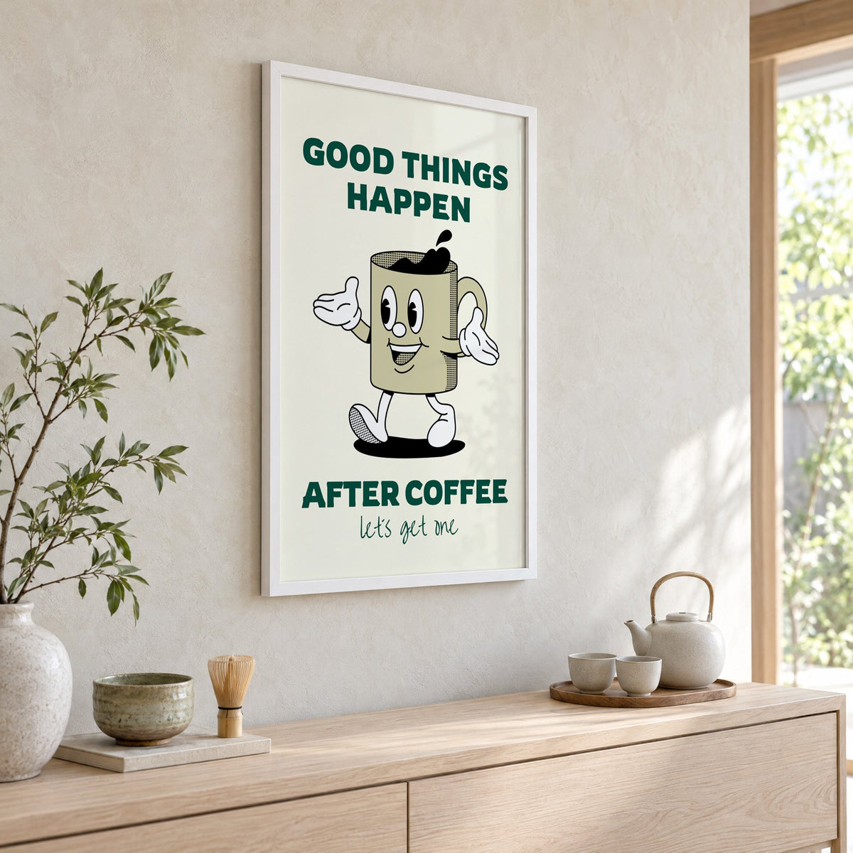 Good Things Happen After Coffee mug print in a white frame above a pale wood console with a matcha tea set