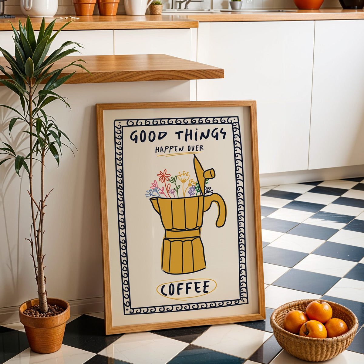 Good things happen over coffee print in an oak frame by a kitchen island and checkered floor