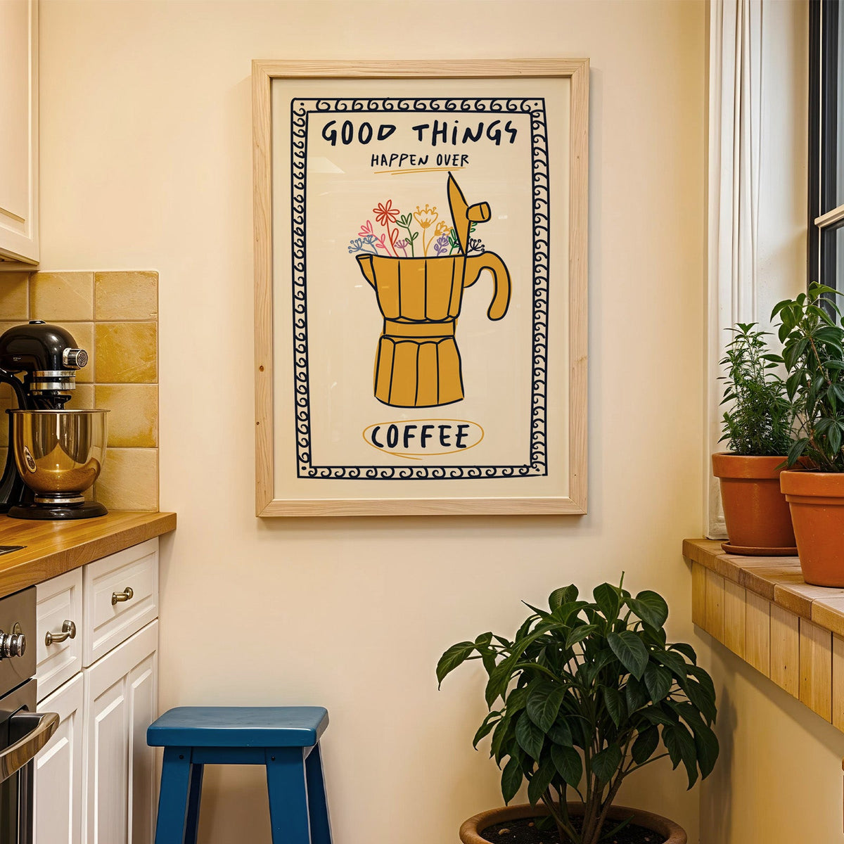 Good things happen over coffee print in a wood frame on a yellow tiled kitchen wall