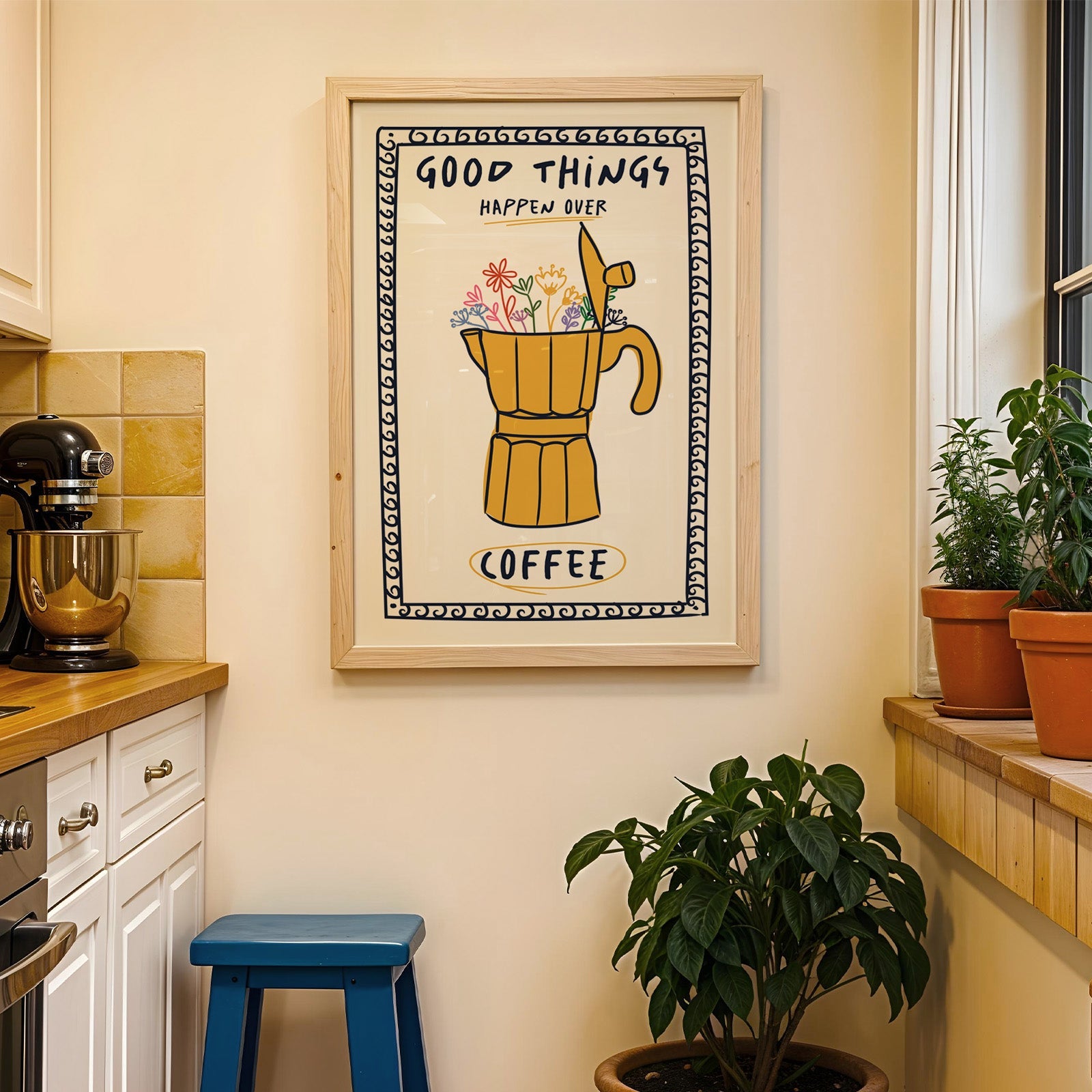 Good things happen over coffee print in a wood frame on a yellow tiled kitchen wall