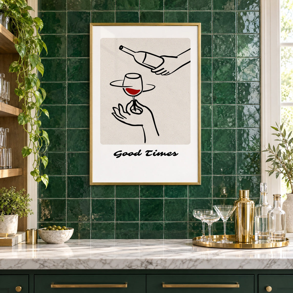Good Times wine pour line art print in a brass frame on emerald green tiles above a home bar with coupe glasses