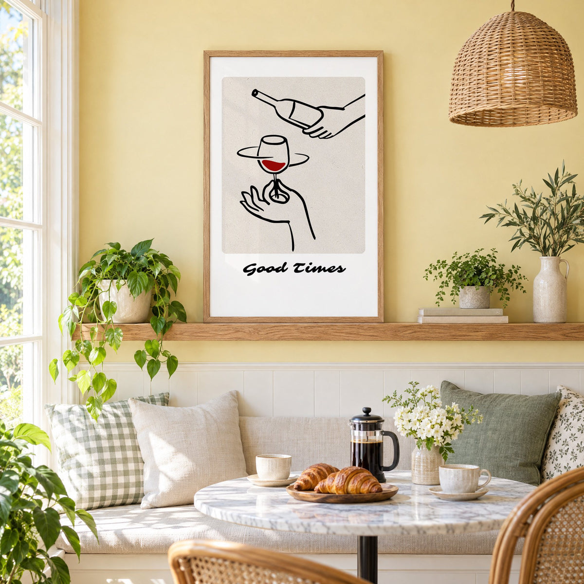 Good Times wine pour line art print in an oak frame on a picture ledge above a sunny breakfast nook