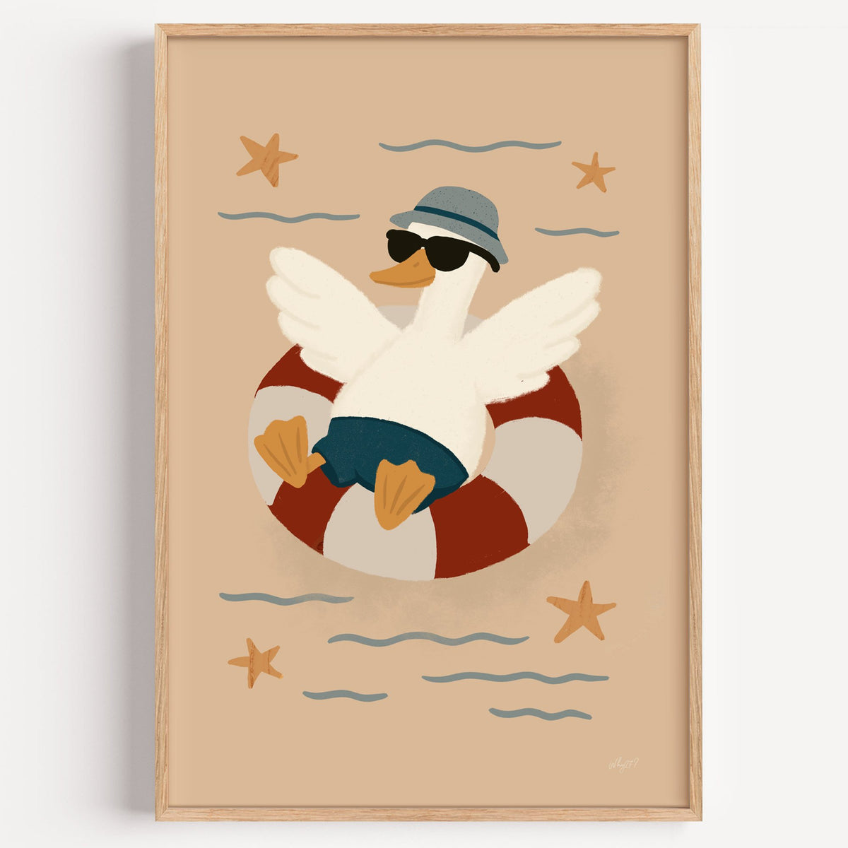 Goose in lifesaver ring nursery print in a light oak frame on a plain white wall