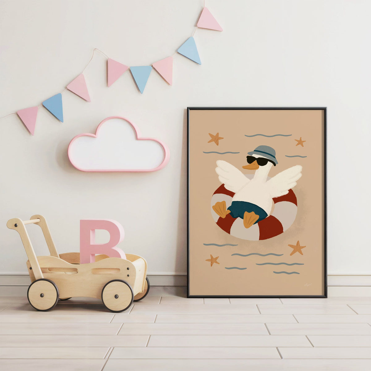 Goose in lifesaver ring nursery print in a black frame under pastel bunting by a wooden baby walker