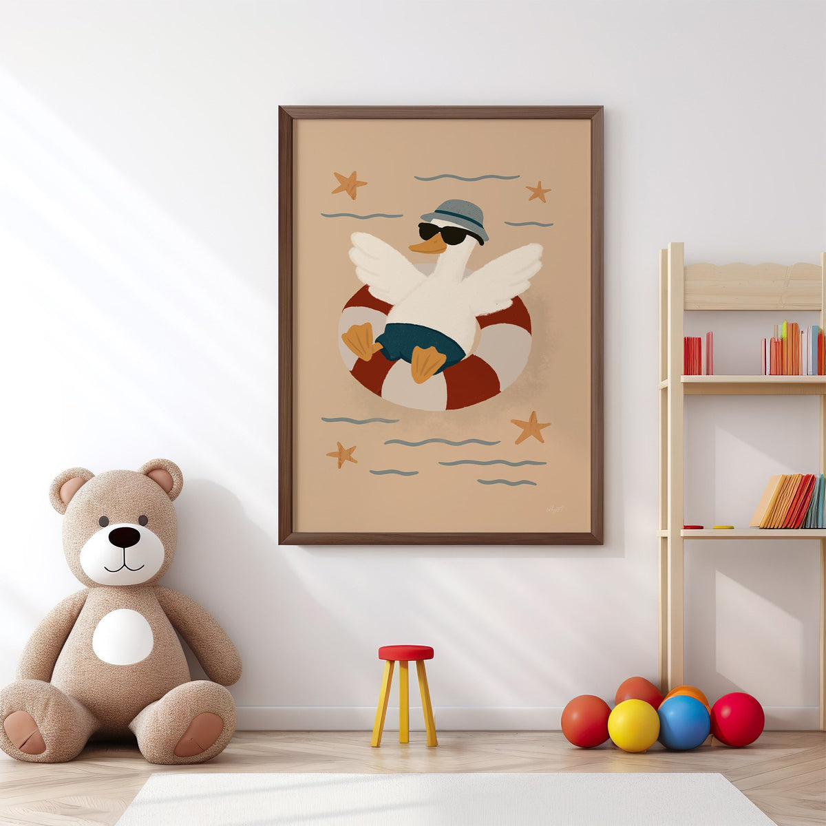 Goose in lifesaver ring nursery print in a walnut frame above a big teddy bear by a bookshelf