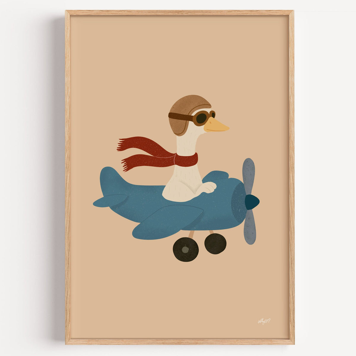 Goose pilot in blue airplane nursery print in a light oak frame on a plain white wall