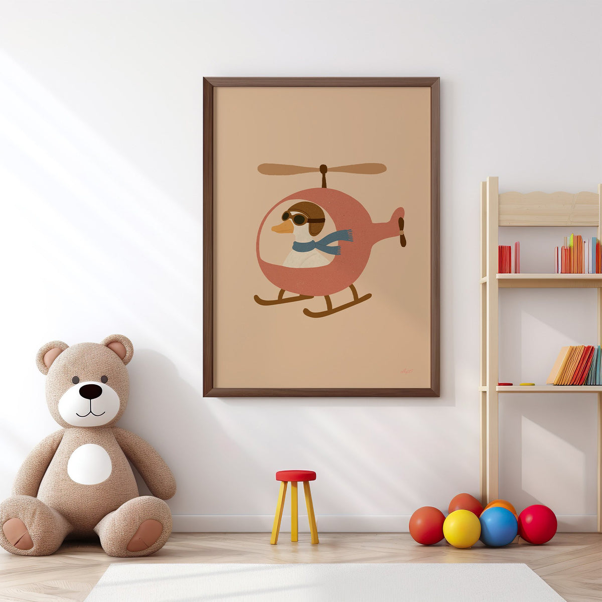 Goose pilot in pink helicopter nursery print in a walnut frame above a big teddy bear by a bookshelf