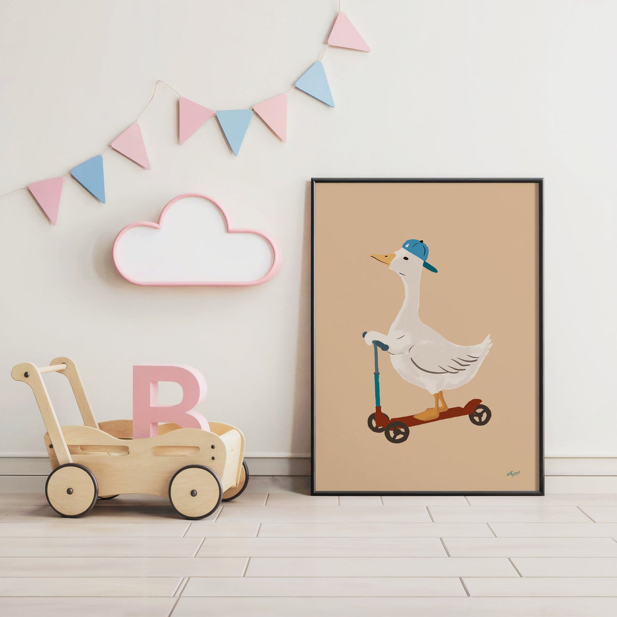 Goose riding scooter in blue cap nursery print in a black frame under pastel bunting by a wooden baby walker