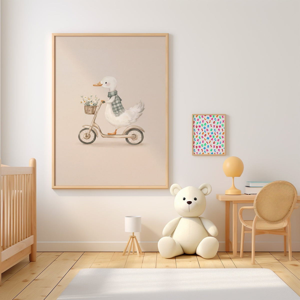 White goose riding a scooter with daisies nursery print in an oak frame above a wooden crib beside a cream teddy bear