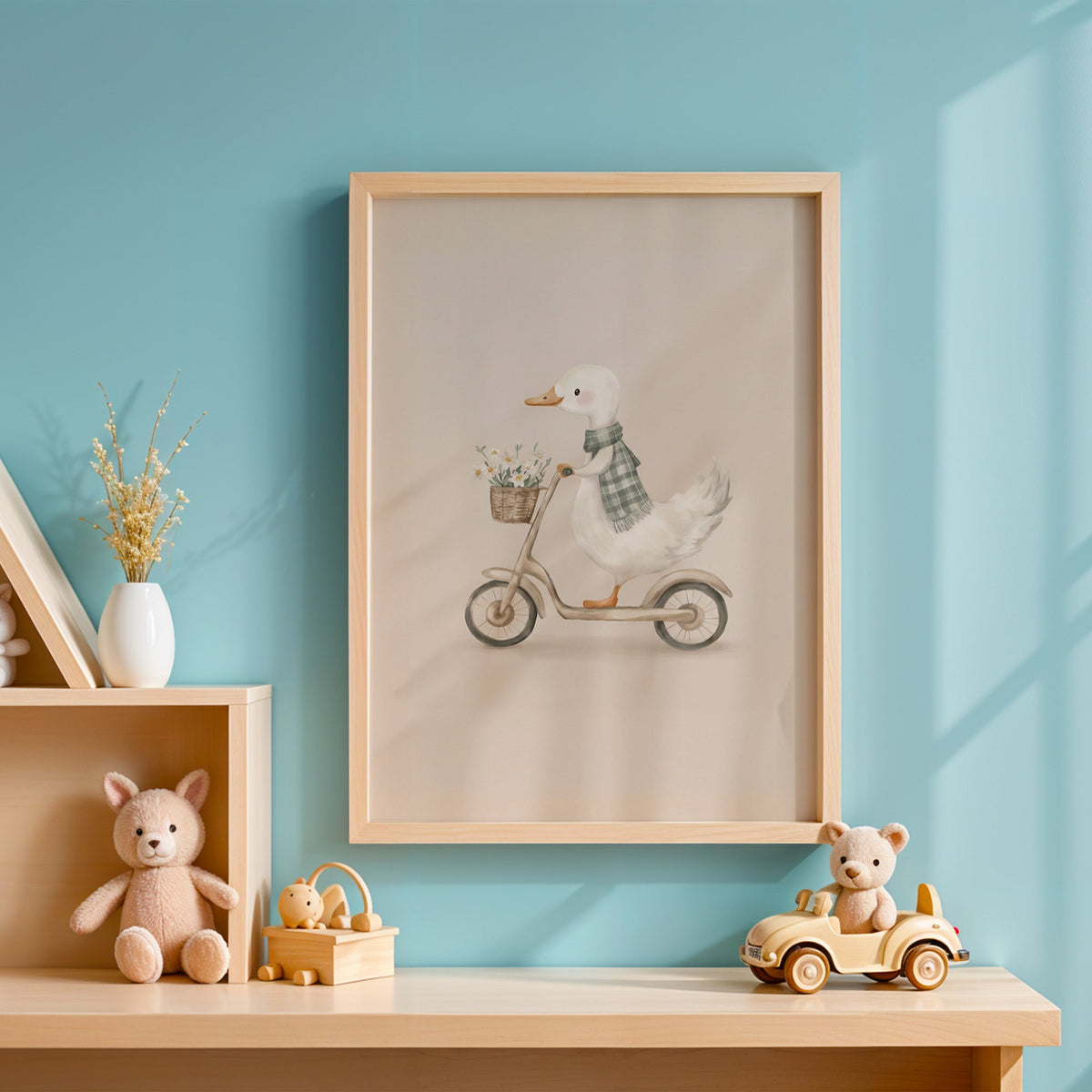 White goose riding a scooter with daisies nursery print in an oak frame on a blue wall above a shelf of wooden toys