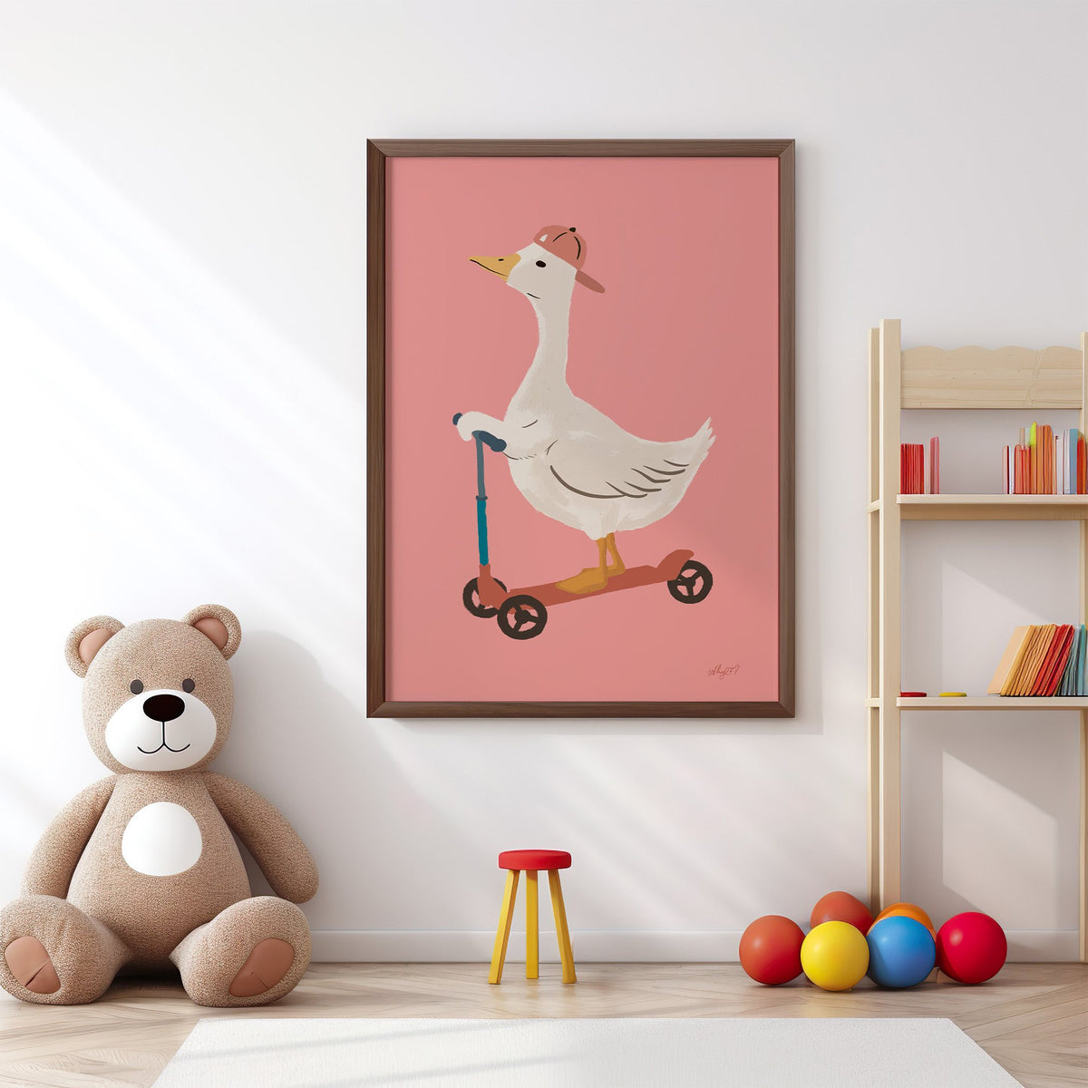Goose on scooter in pink cap nursery print in a walnut frame above a big teddy bear by a bookshelf