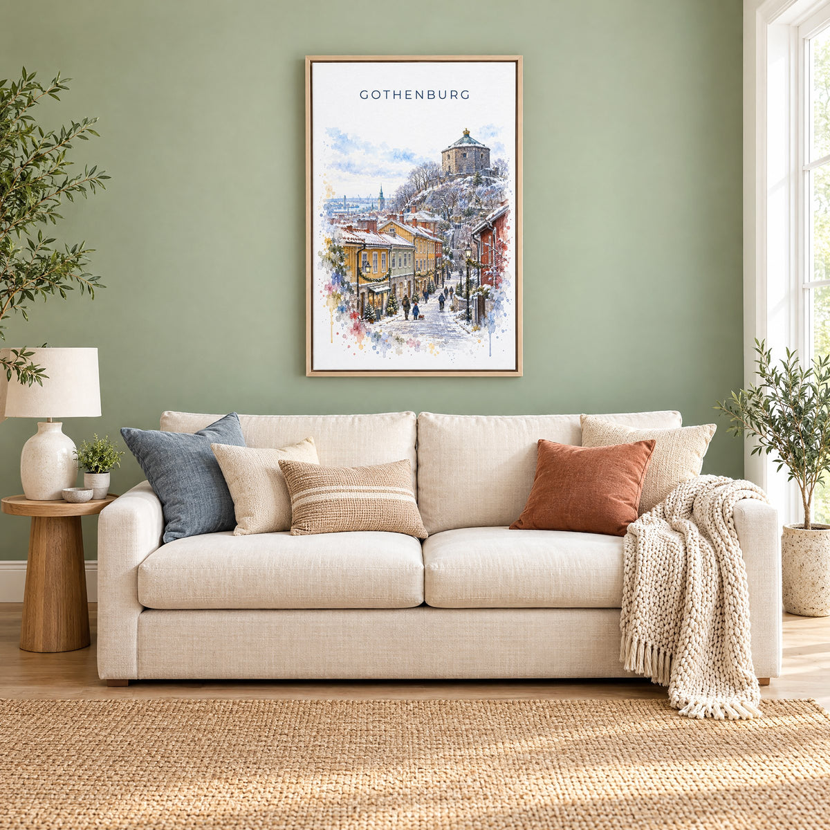 Gothenburg watercolor print as a natural floater canvas above a cream linen sofa on a sage green wall