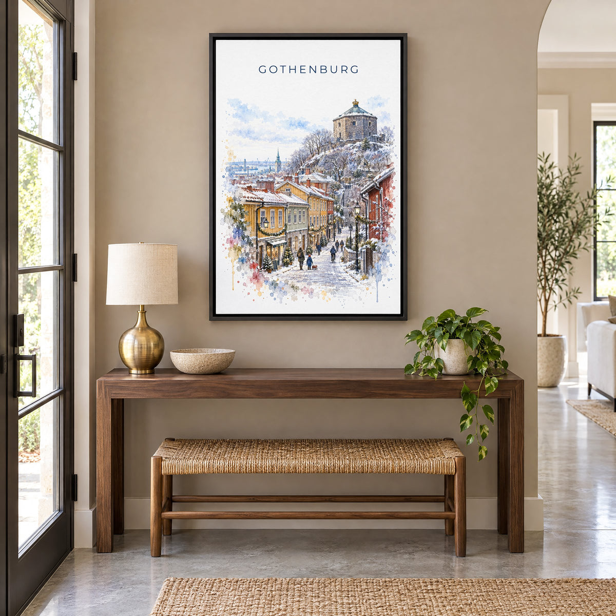 Gothenburg watercolor print as a black floater canvas above a walnut console and woven bench in an entryway