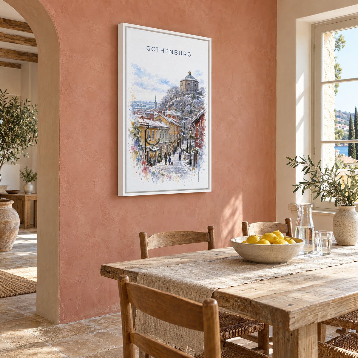 Gothenburg watercolor print as a white floater canvas on a terracotta wall above a rustic dining table