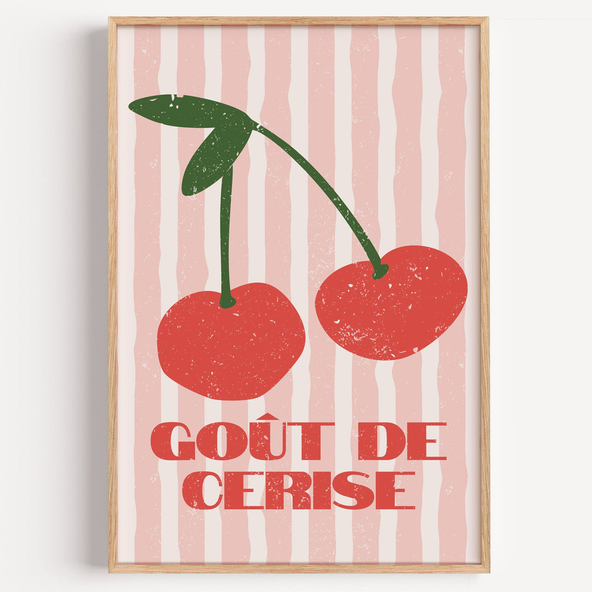 Gout de Cerise cherry stripe print in a light oak frame on a plain white wall