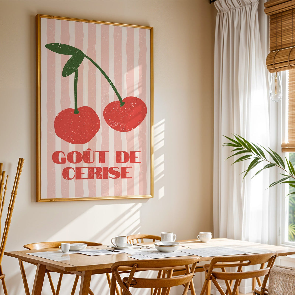 Gout de Cerise cherry print shown in a gold frame above a breakfast table by a curtained window