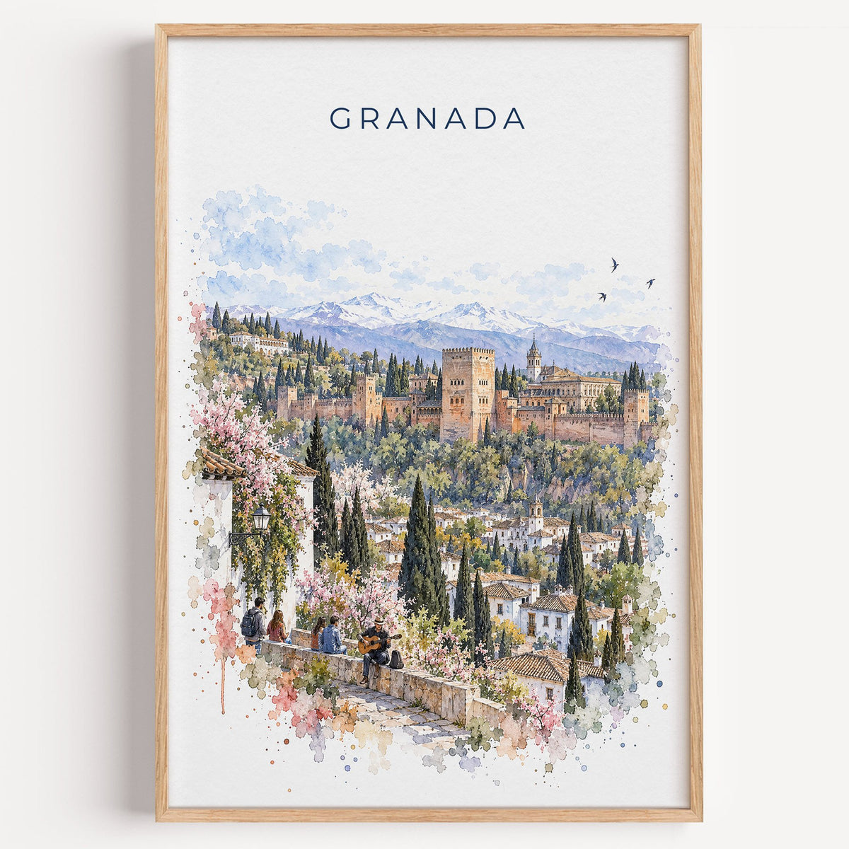 Granada, Spain watercolor print in a light oak frame on a plain white wall