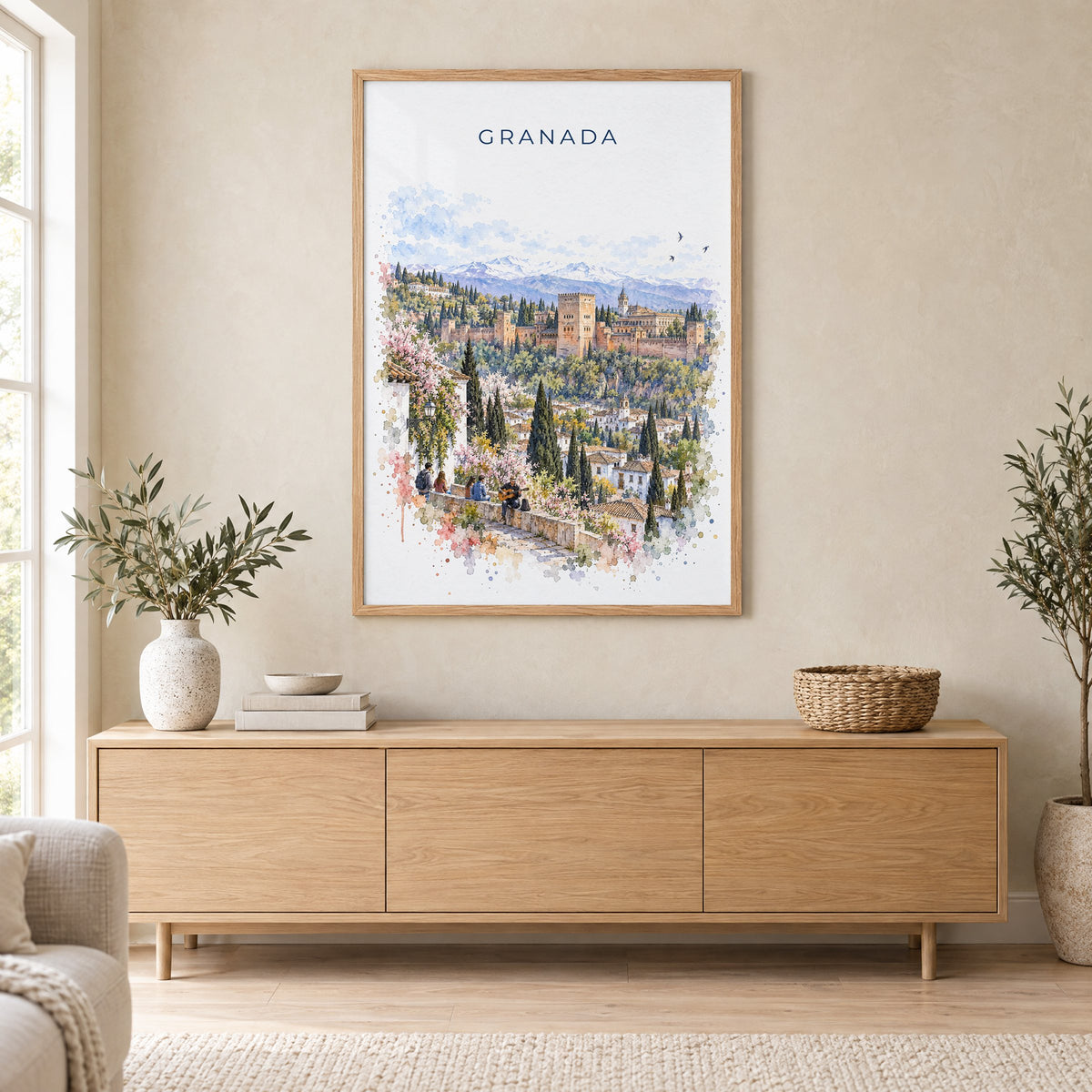 Granada, Spain watercolor print in an oak frame above a light wood sideboard in a Scandinavian living room