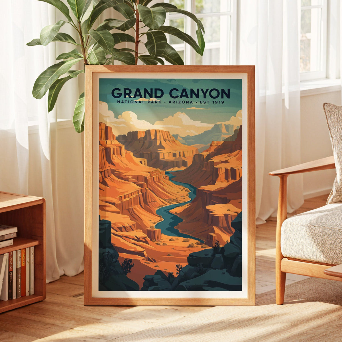 Grand Canyon National Park print in an oak frame by a sunlit window with sheer curtains and a fig plant