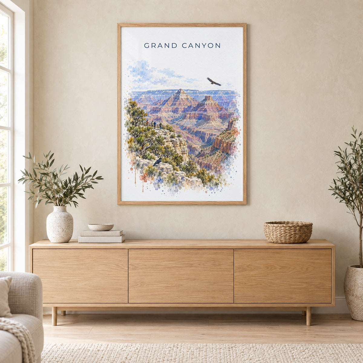 Grand Canyon National Park watercolor print in an oak frame above a light wood sideboard in a Scandinavian living room
