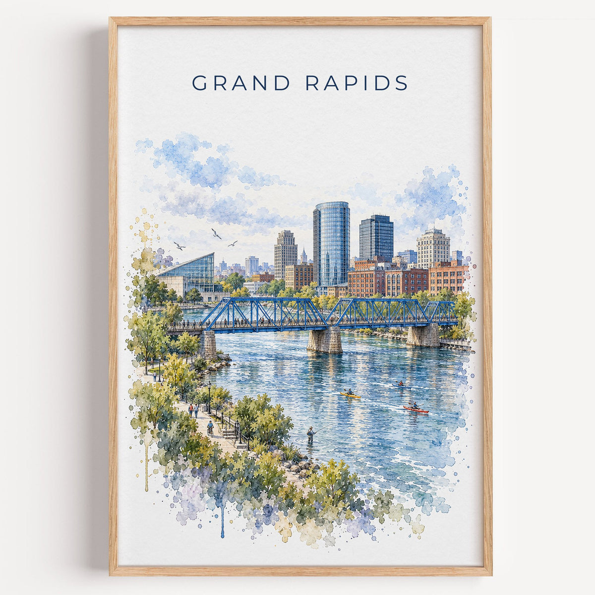 Grand Rapids watercolor print in a light oak frame on a plain white wall