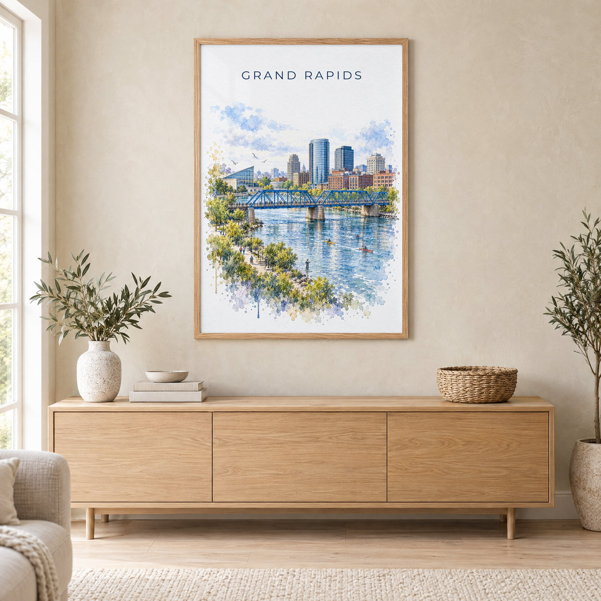 Grand Rapids watercolor print in an oak frame above a light wood sideboard in a Scandinavian living room