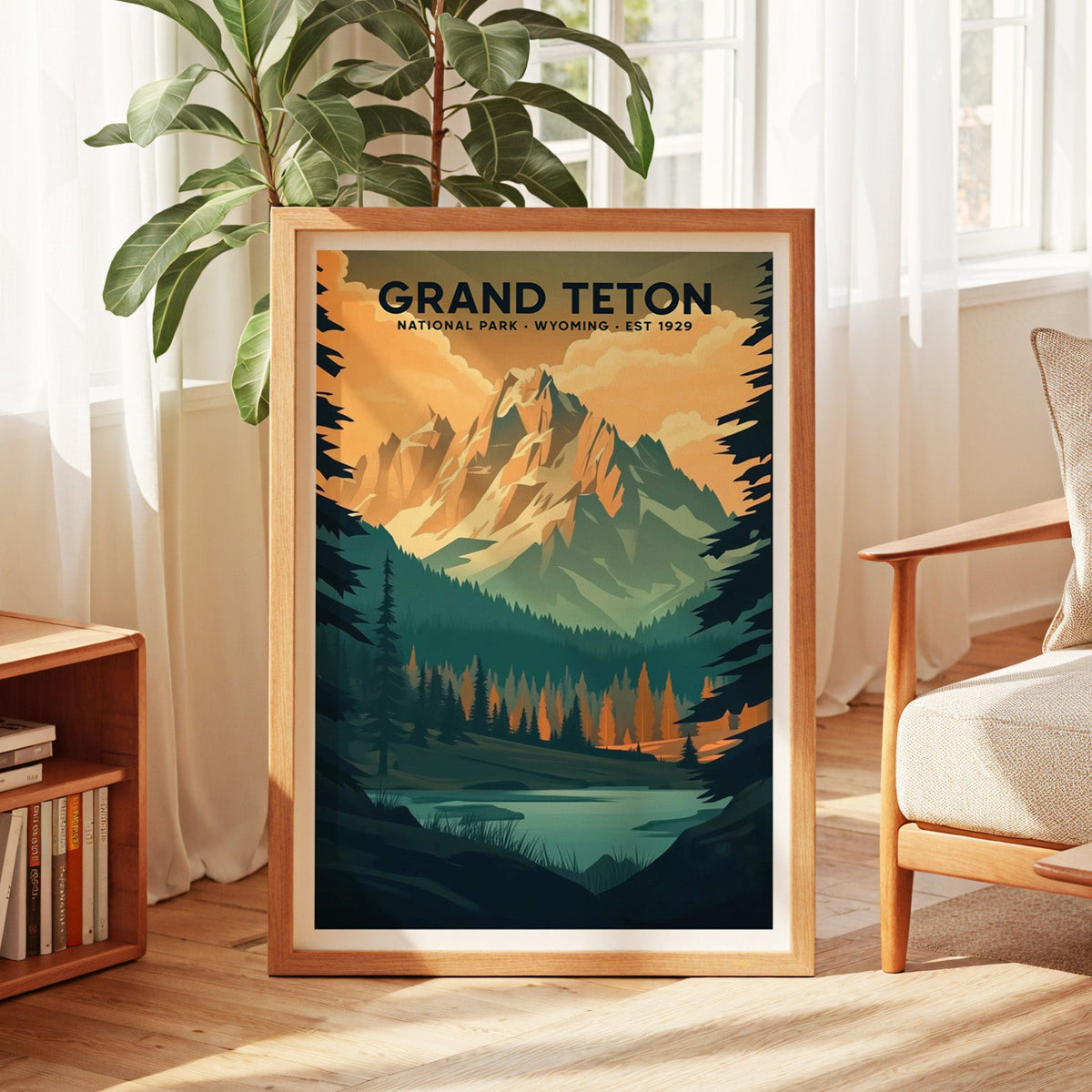 Grand Teton National Park print in an oak frame by a sunlit window with sheer curtains and a fig plant