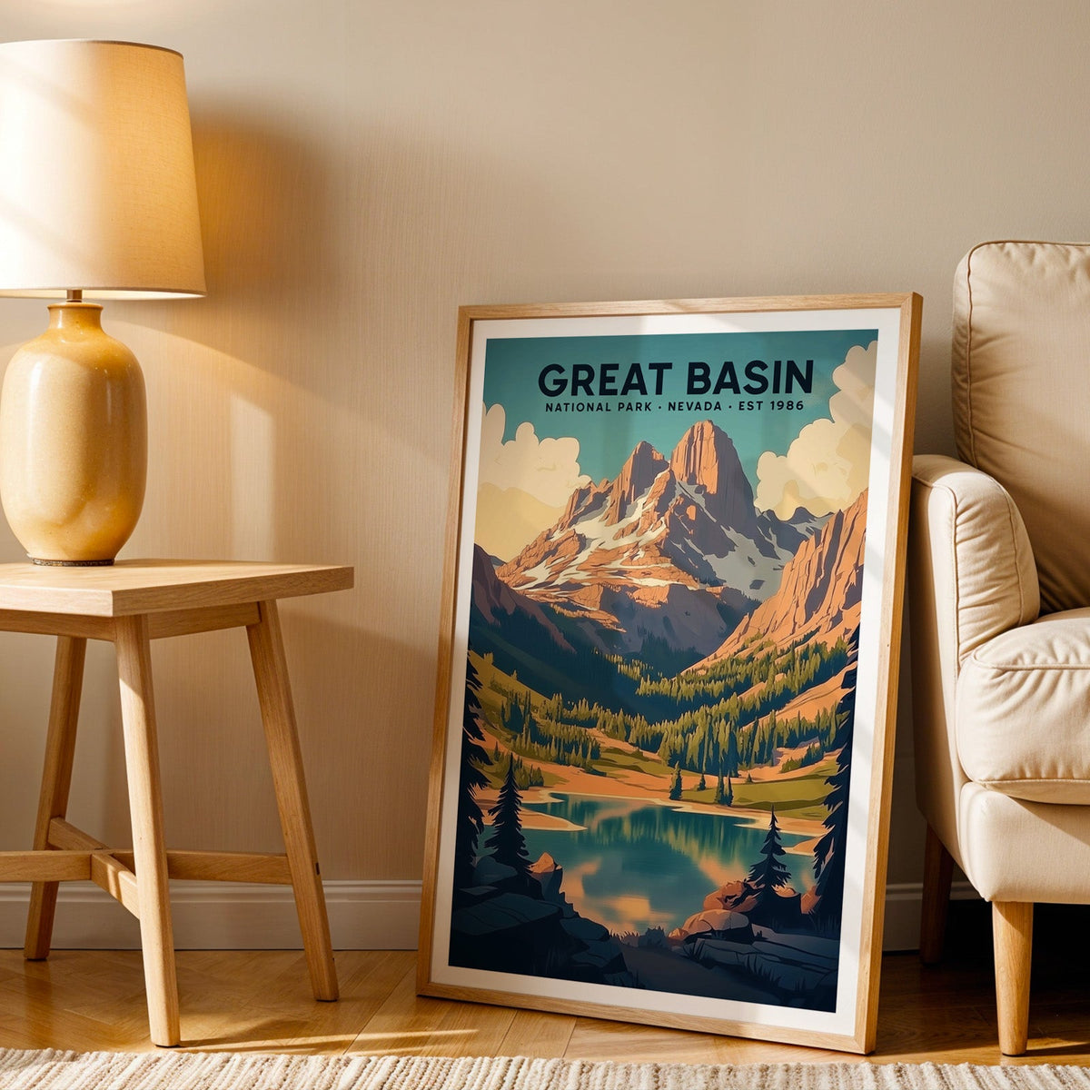 Great Basin print in an oak frame beside a cream armchair and an amber lamp in warm light