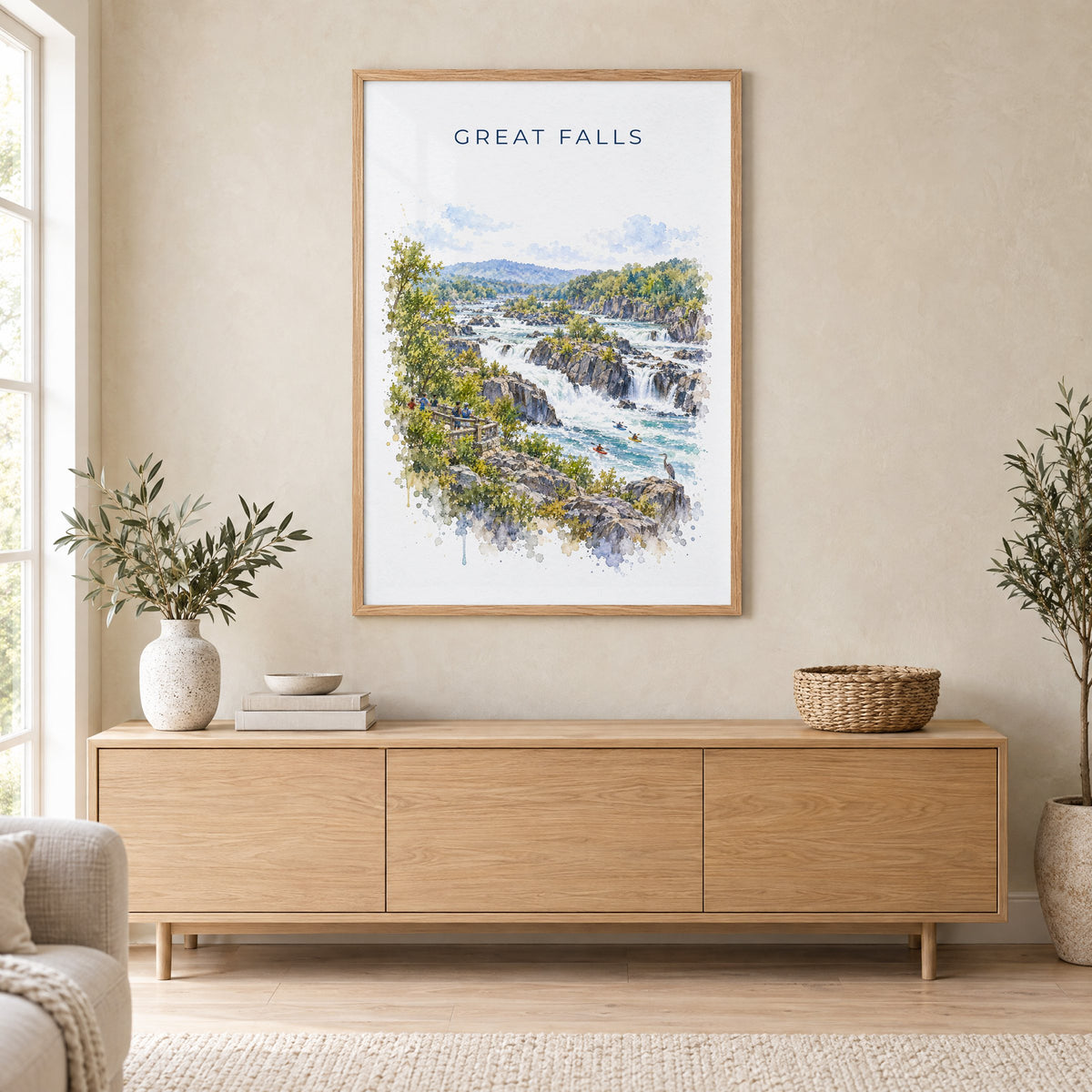 Great Falls Park watercolor print in an oak frame above a light wood sideboard in a Scandinavian living room