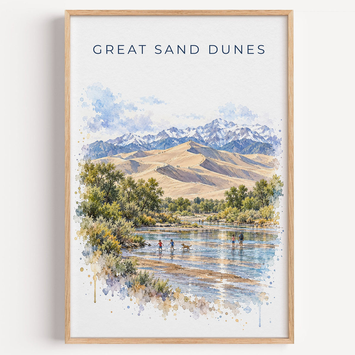 Great Sand Dunes National Park watercolor print in a light oak frame on a plain white wall