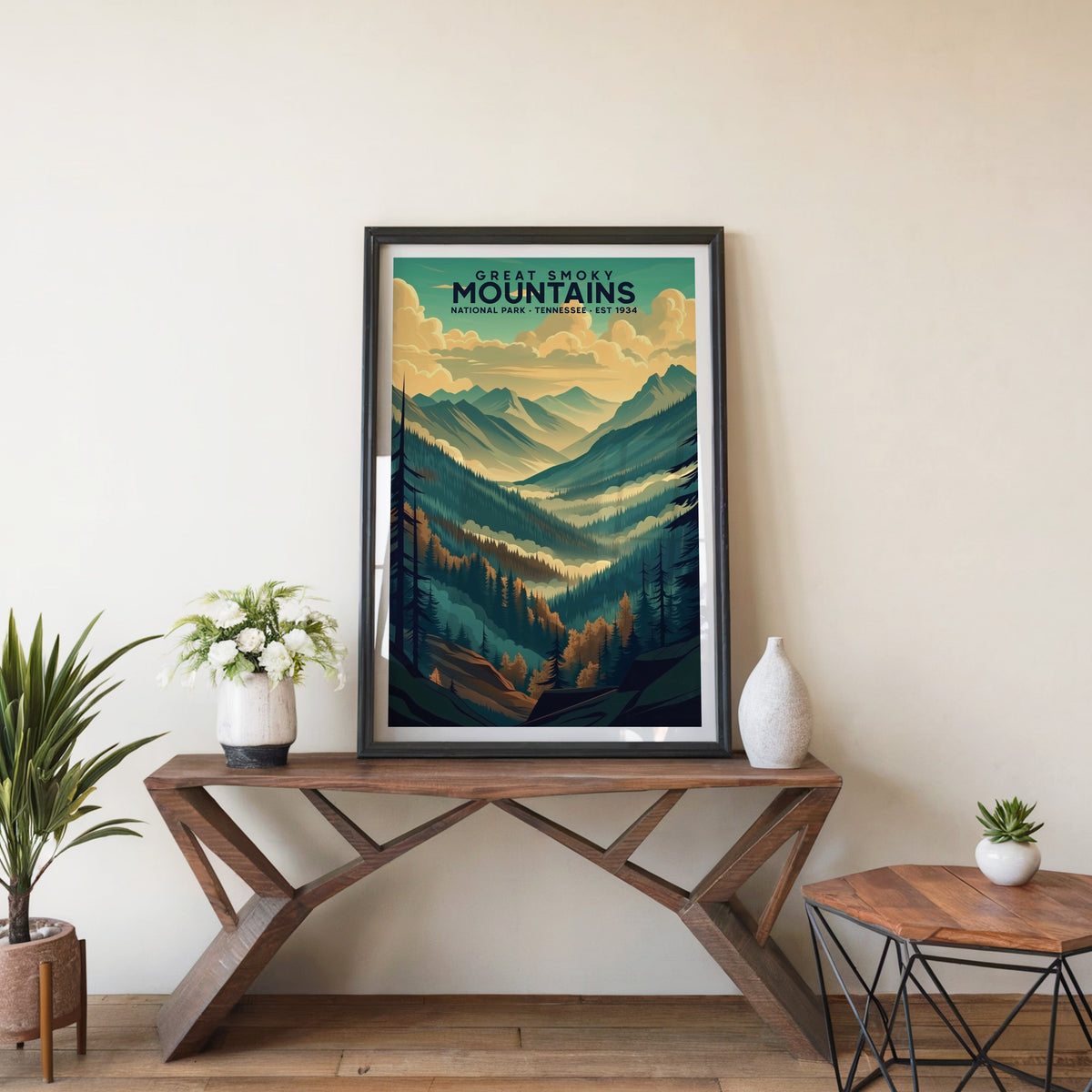 Great Smoky Mountains poster in a black frame on an entryway console table with white flowers