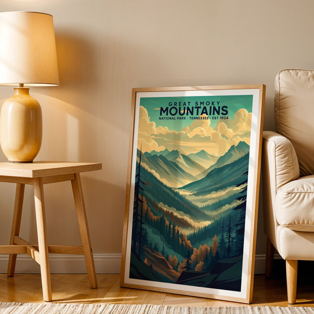 Great Smoky Mountains print in an oak frame beside a cream armchair and an amber lamp in warm light