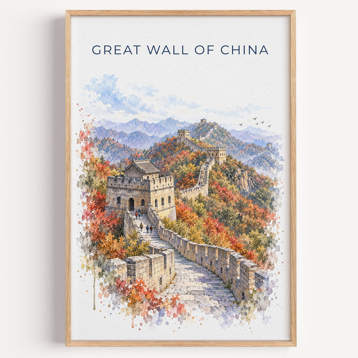 Great Wall of China watercolor print in a light oak frame on a plain white wall