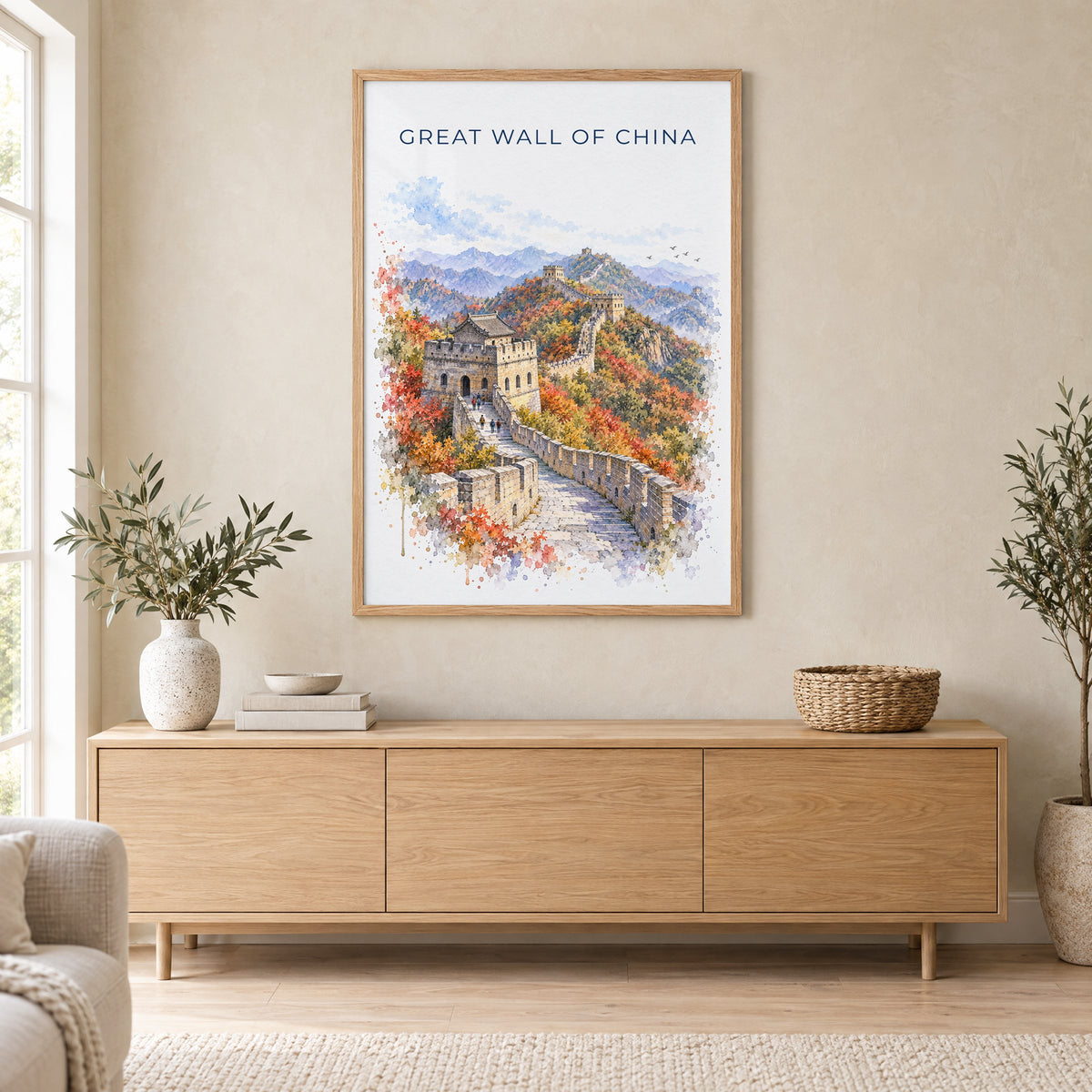 Great Wall of China watercolor print in an oak frame above a light wood sideboard in a Scandinavian living room