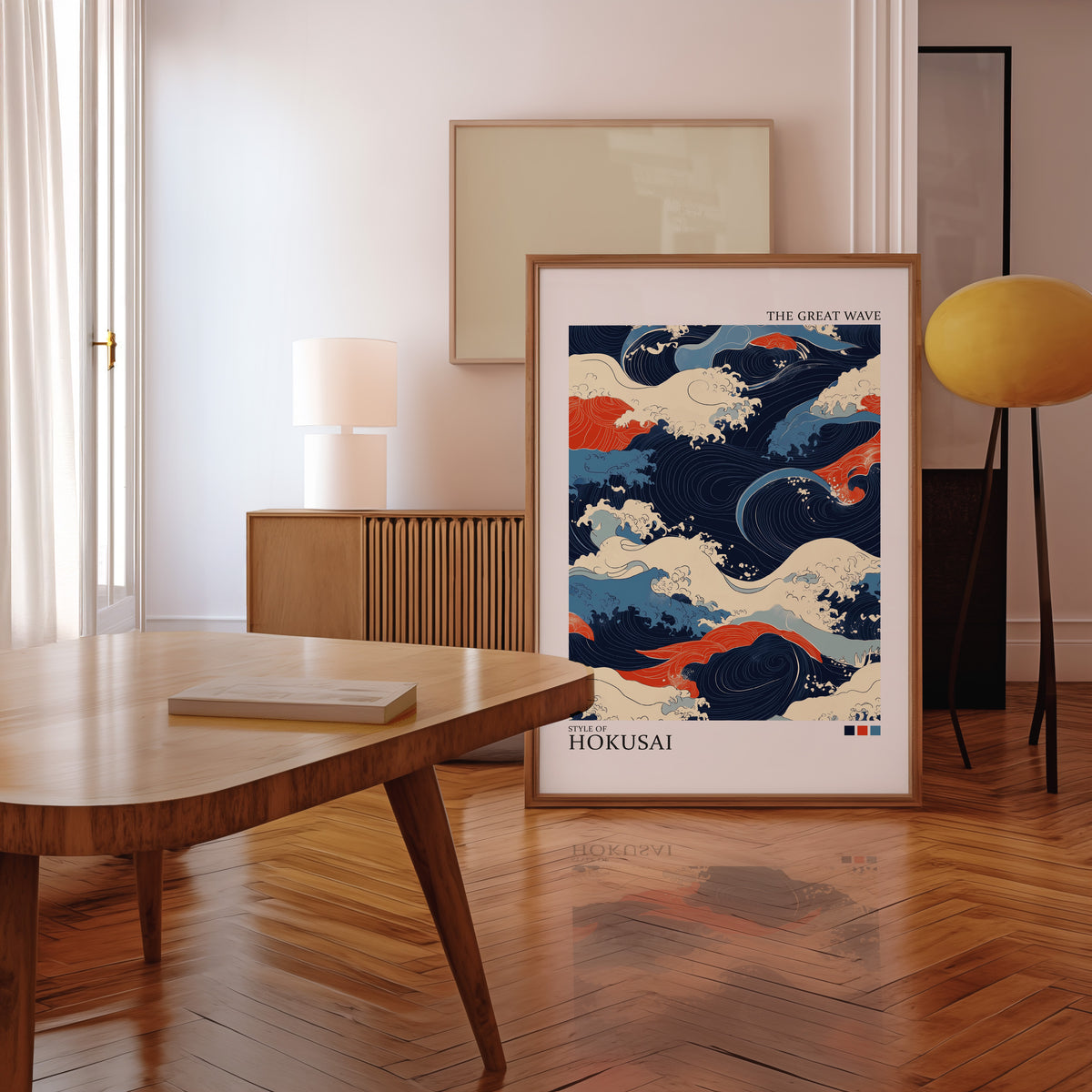 Navy and orange Great Wave print in a walnut frame leaning in a mid-century living room