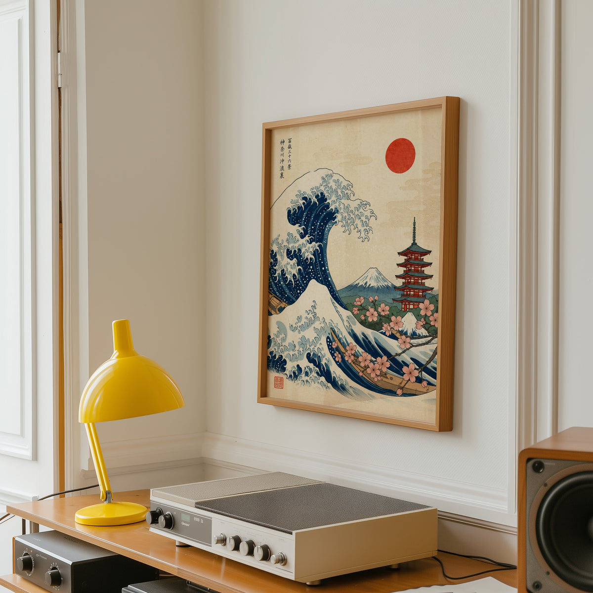 Great Wave with pagoda and cherry blossom print in an oak frame above a vintage hi-fi shelf with a yellow desk lamp