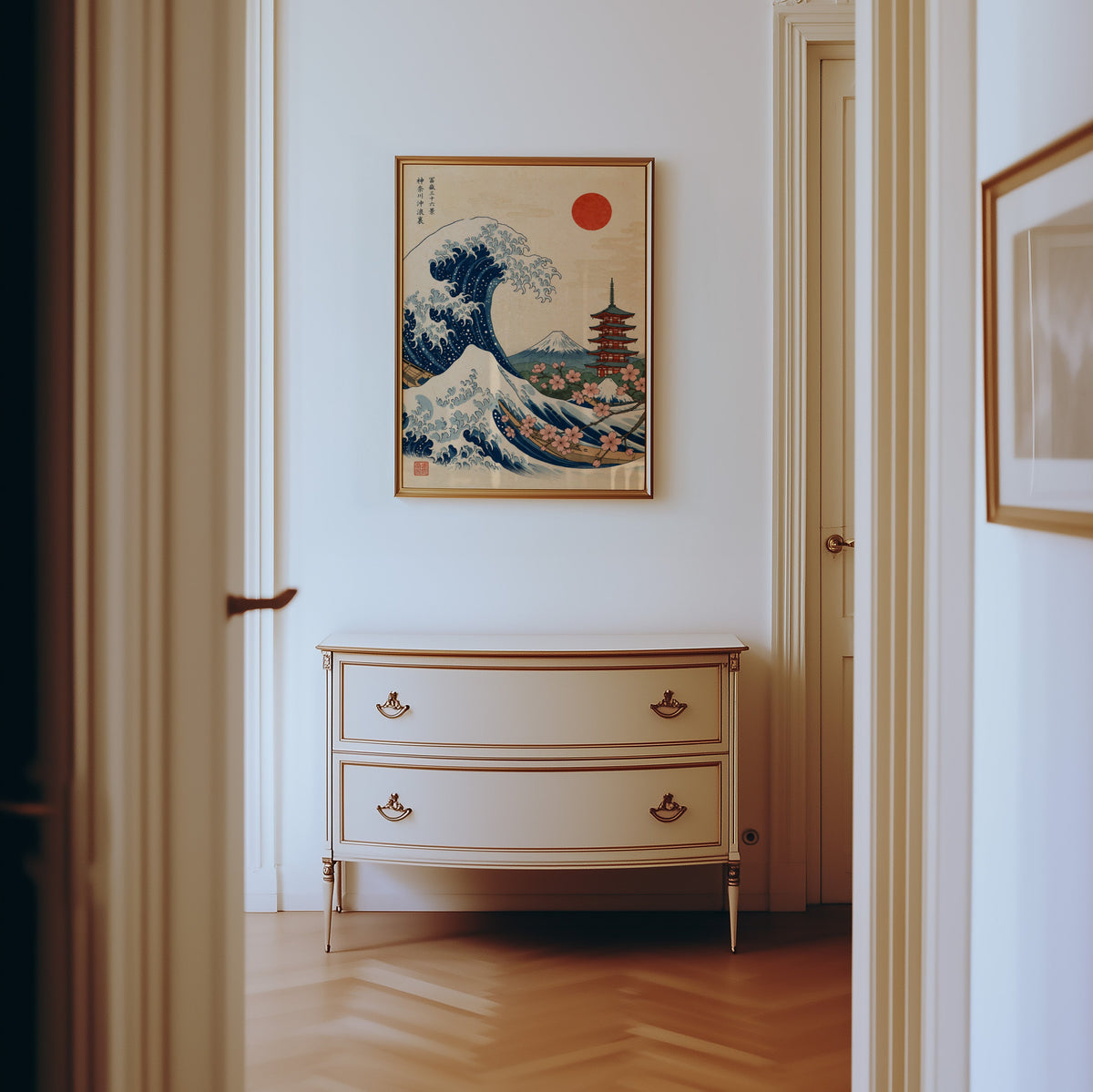 Great Wave with pagoda and cherry blossom print shown in a gold frame in a hallway above a cream dresser