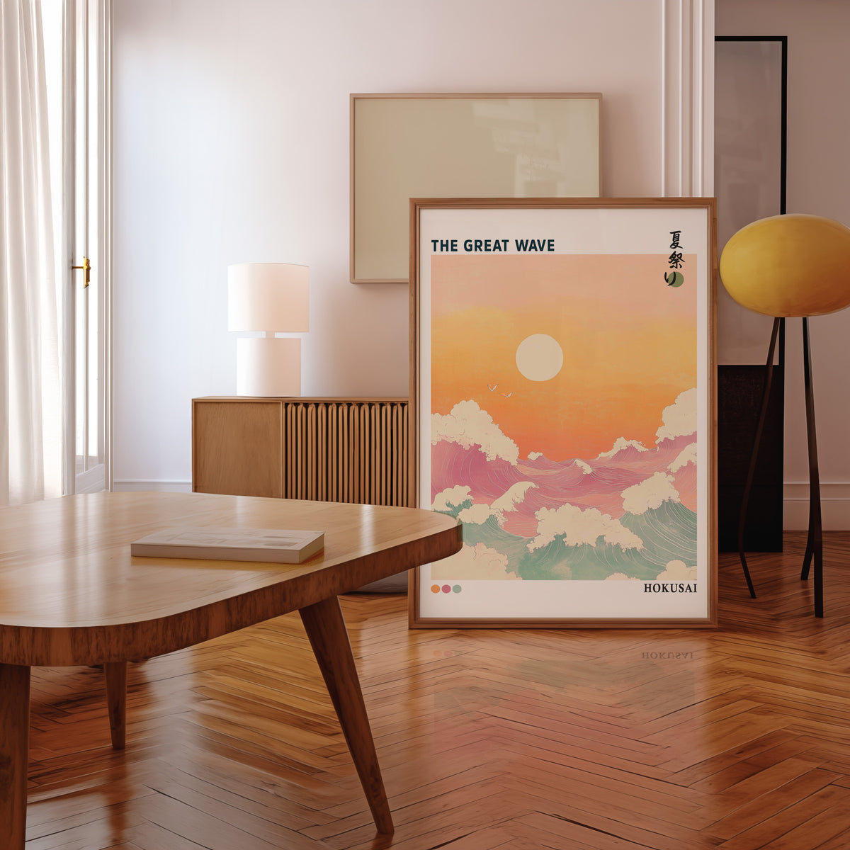 Pastel Great Wave sunset print in a walnut frame leaning in a mid-century living room