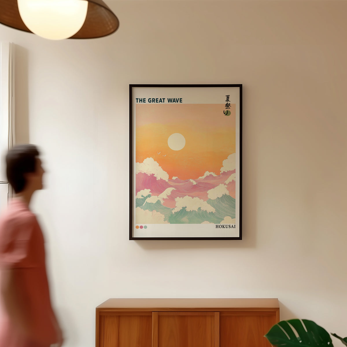 Pastel Great Wave sunset print in a black frame in a hallway under a rattan pendant