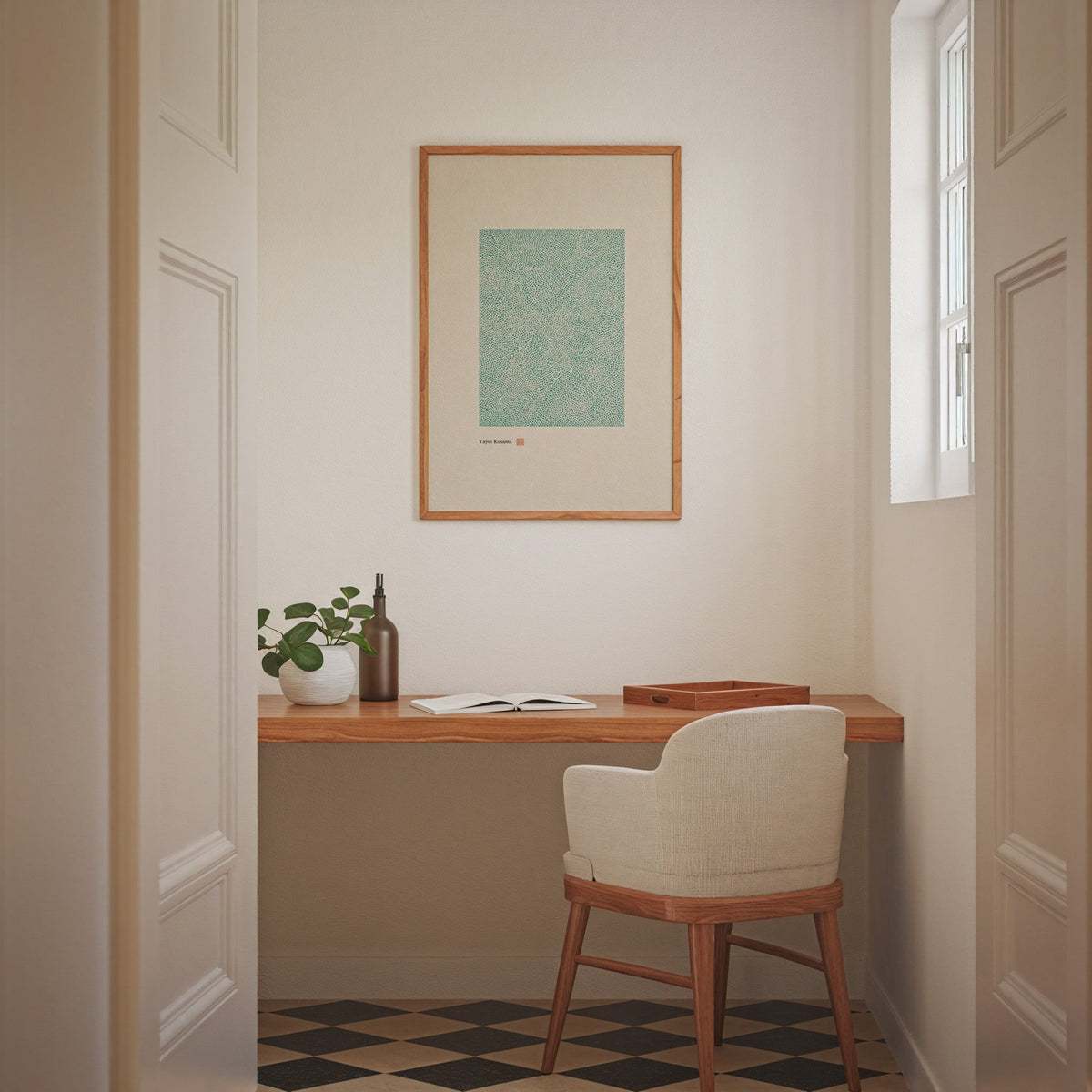 green dot field abstract print in an oak frame above a wall-mounted desk in a home office nook