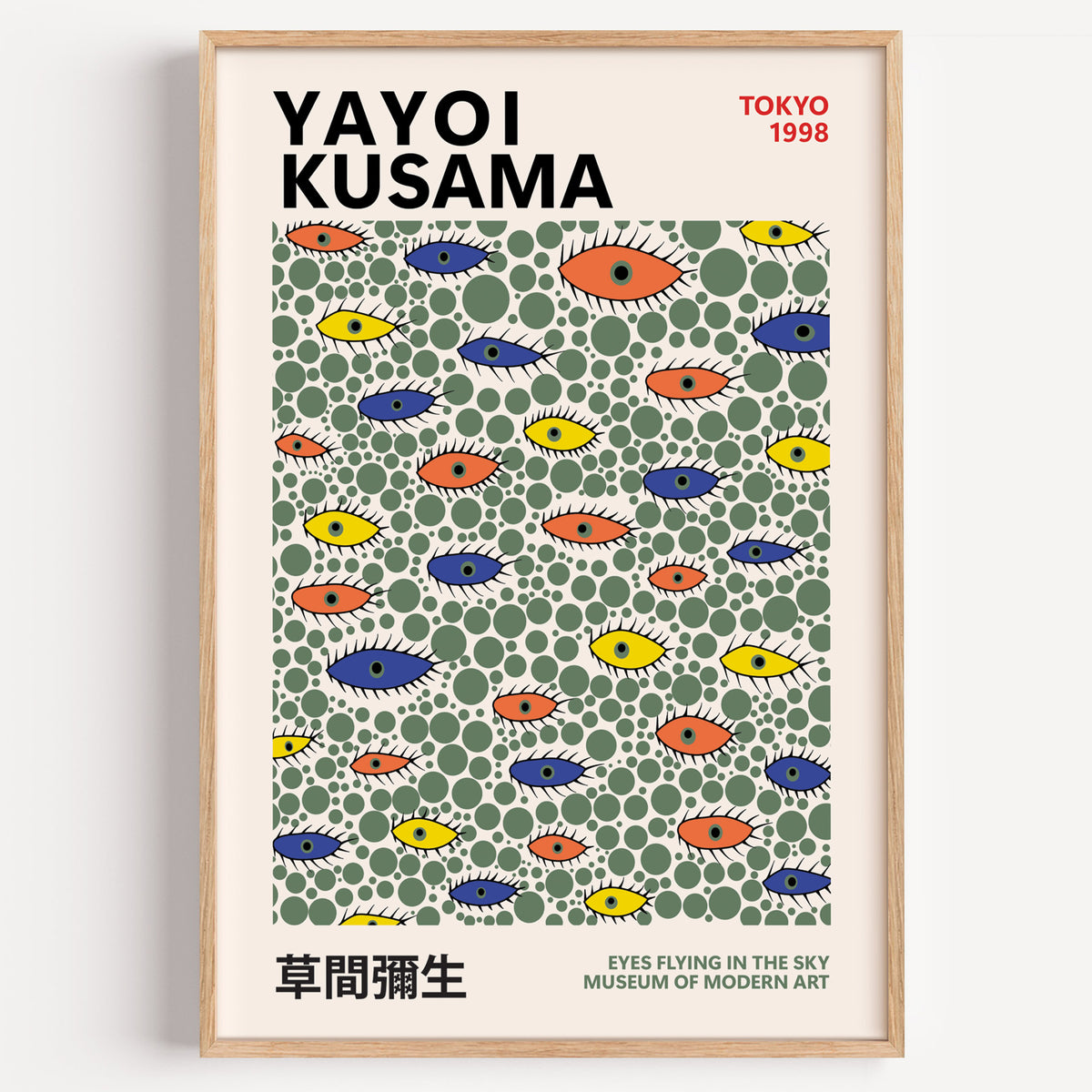 Yayoi Kusama inspired green dots and eyes print in a wood frame on a plain wall