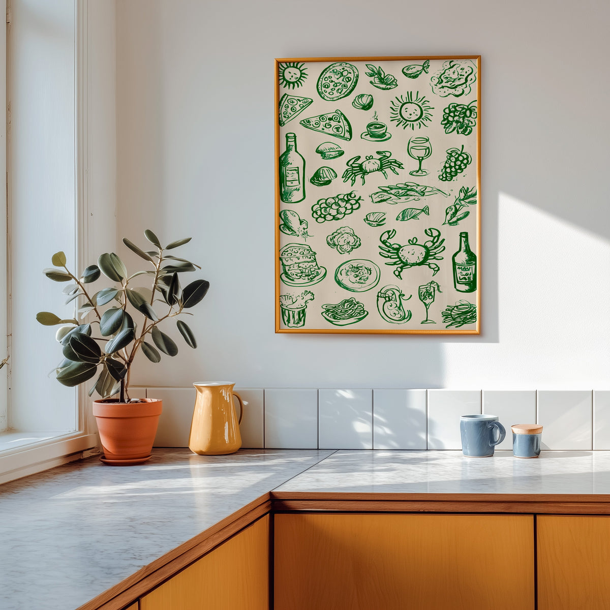 Green food doodle print shown in a gold frame above a marble counter in a tan kitchen
