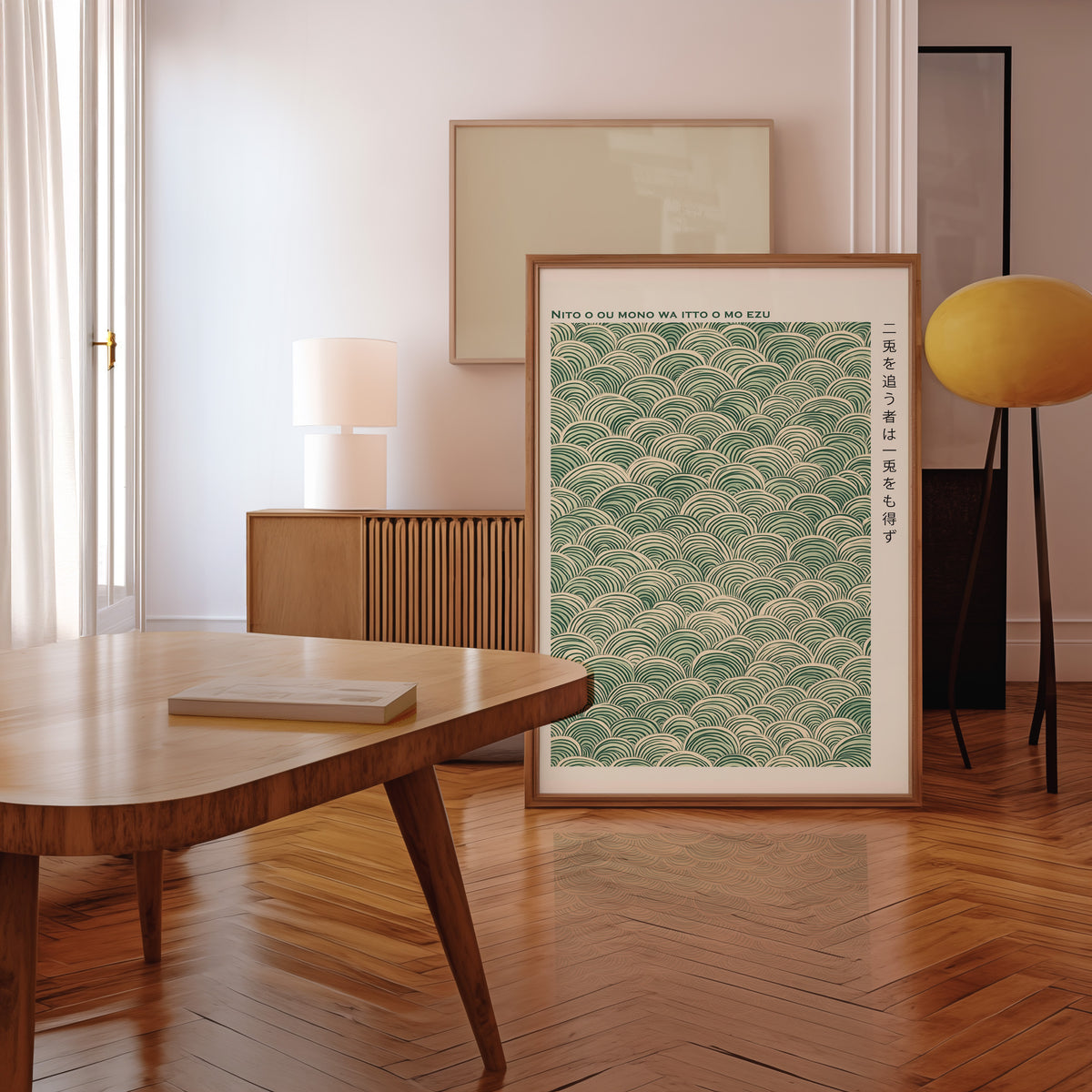 Green seigaiha wave proverb print in a walnut frame leaning in a mid-century living room