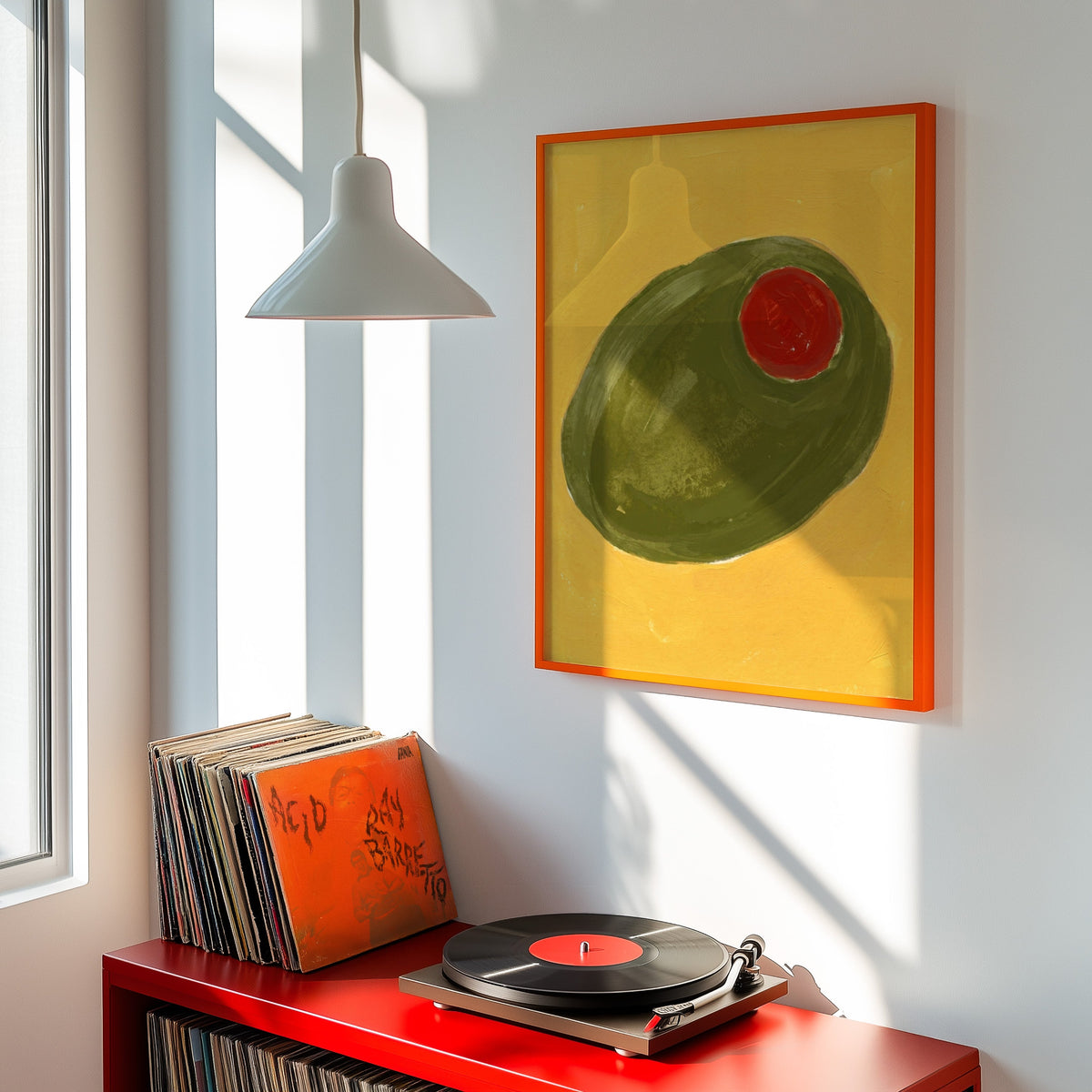 Cocktail olive print shown in an orange frame above a red record cabinet and turntable