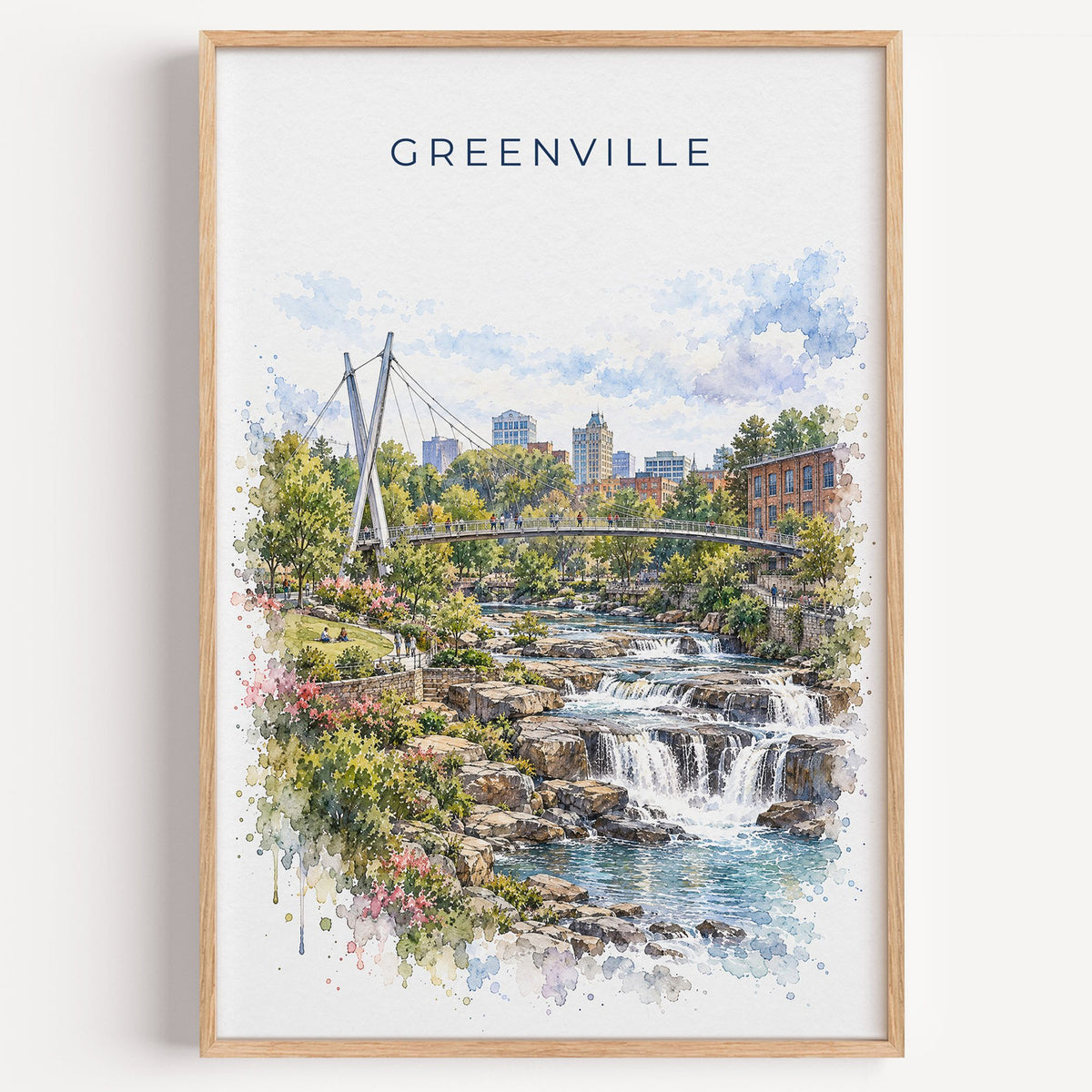 Greenville, South Carolina watercolor print in a light oak frame on a plain white wall