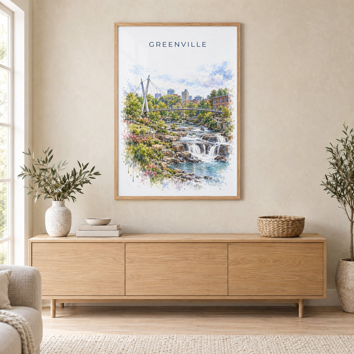 Greenville, South Carolina watercolor print in an oak frame above a light wood sideboard in a Scandinavian living room